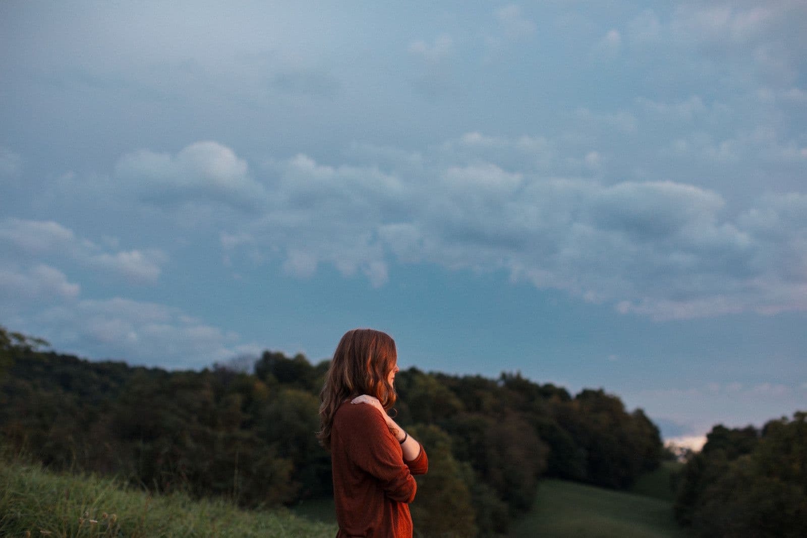 A women in a red top, taking in the view.